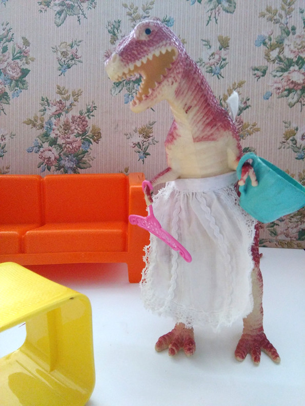 Photo of a Tyrannosaurus rex doing housework